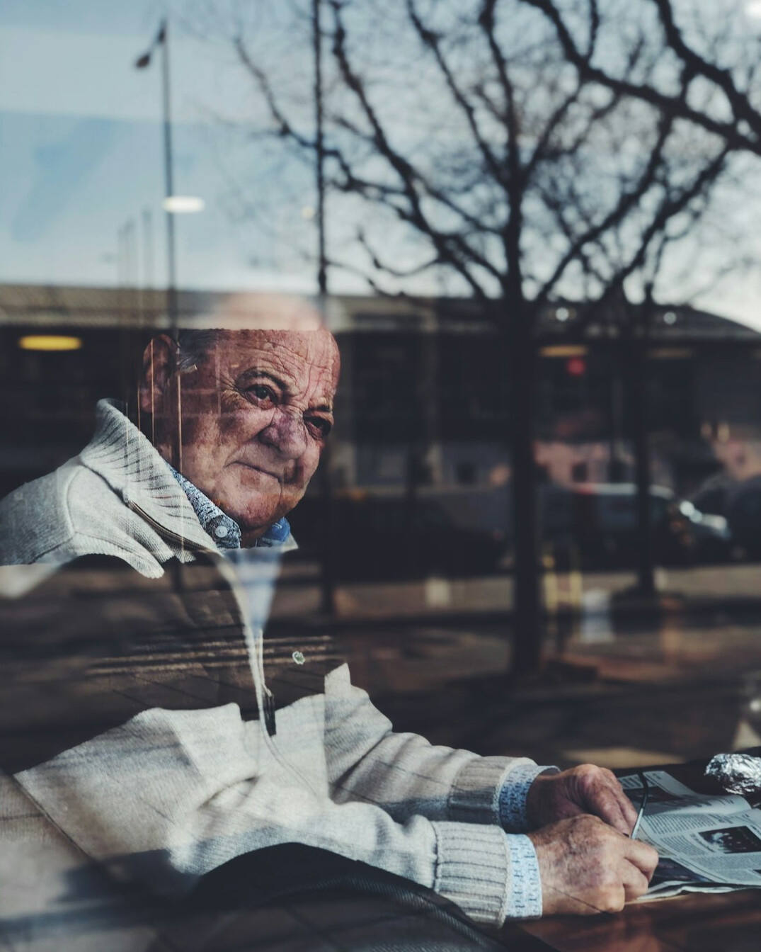 senior man smiling at laptop