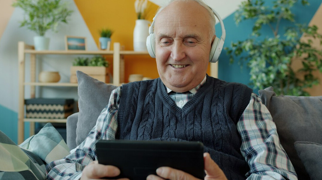 senior using voice assistant
