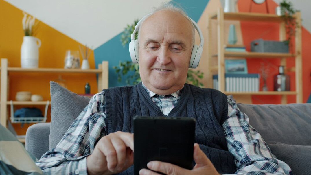 elderly person using tablet